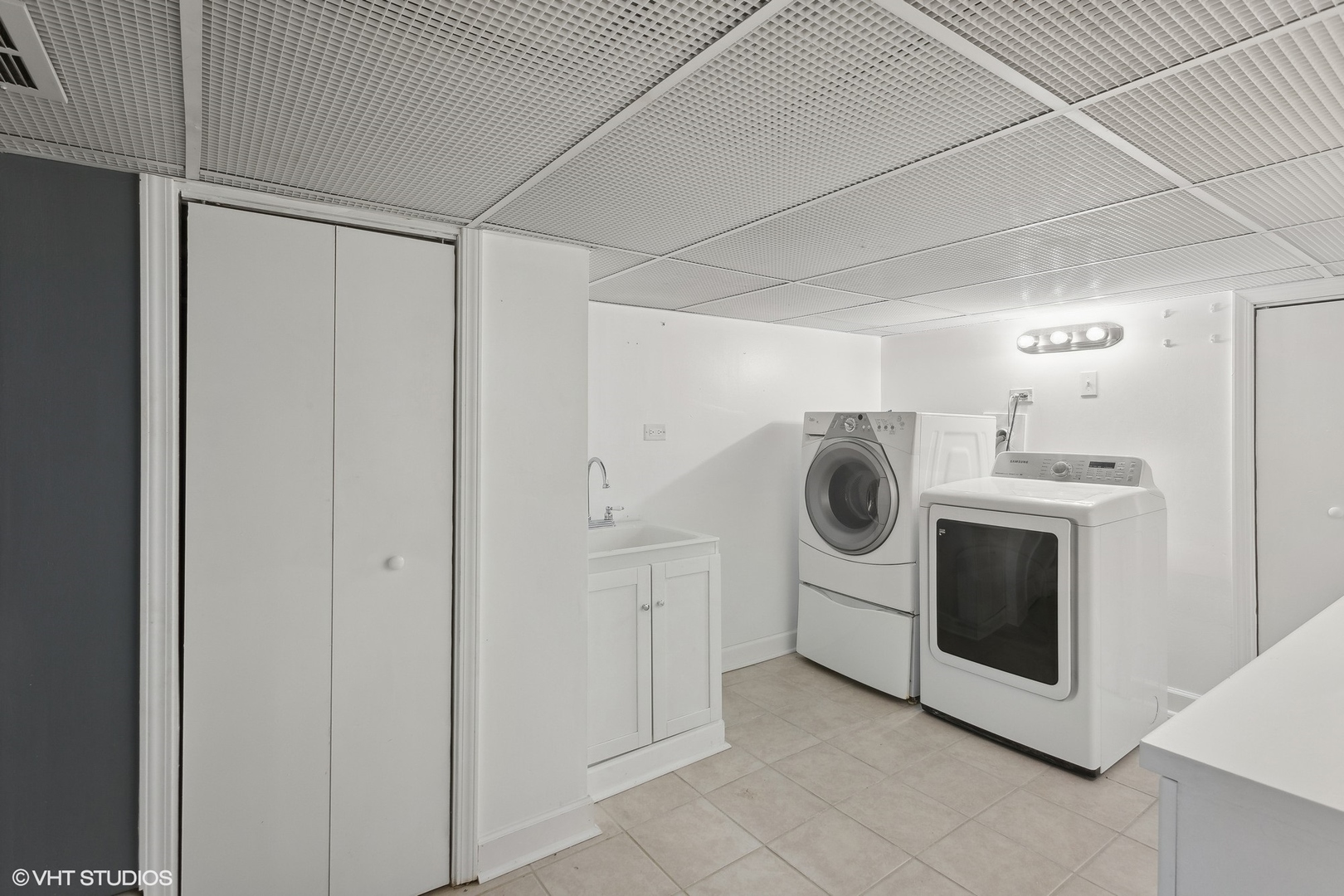 8501 Harding Avenue Skokie, IL 60076 - Photo 30 of 37 a utility room with cabinets washer and dryer