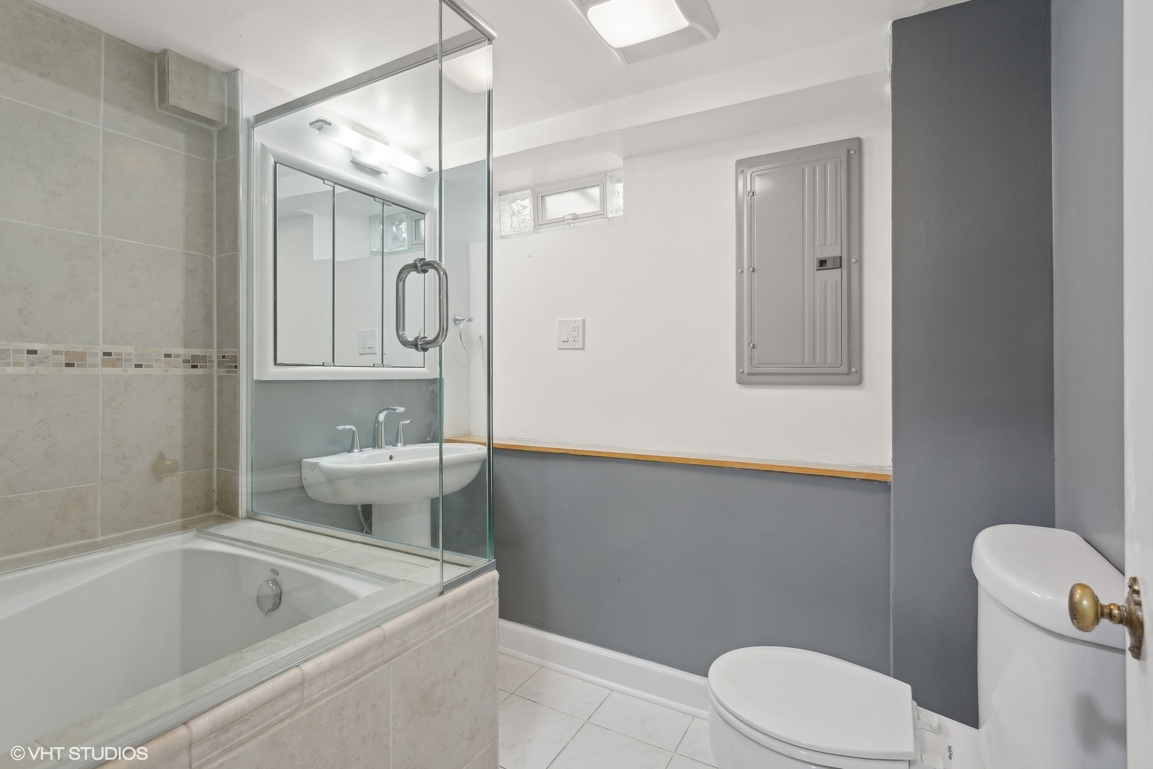 8501 Harding Avenue Skokie, IL 60076 - Photo 31 of 37 a bathroom with a sink a toilet and shower