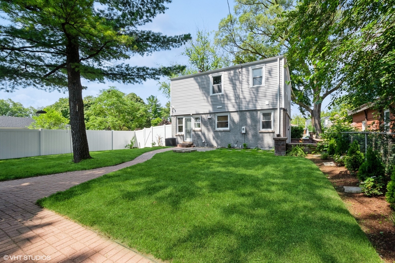 8501 Harding Avenue Skokie, IL 60076 - Photo 32 of 37 a view of house with backyard and garden