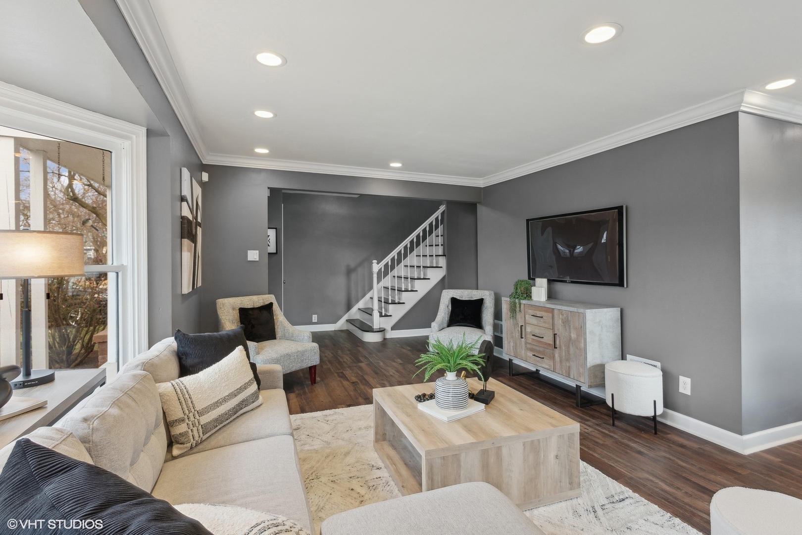 8501 Harding Avenue Skokie, IL 60076 - Photo 6 of 37 a living room with furniture and a wooden floor