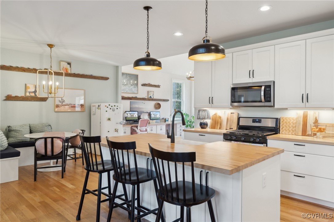 13279 Hanover Courthouse Road Hanover, VA 23069 - Photo 12 of 50 Kitchen featuring white cabinets, a notable chande