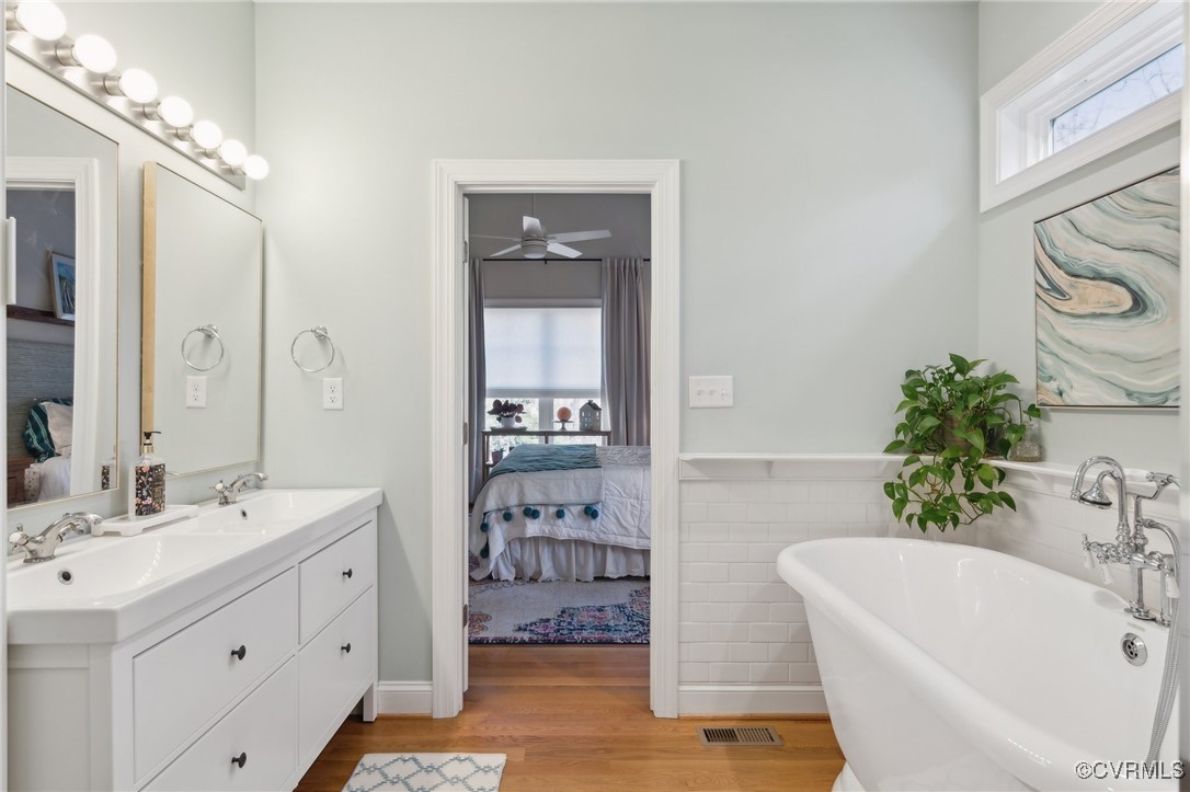 13279 Hanover Courthouse Road Hanover, VA 23069 - Photo 23 of 50 Ensuite bathroom featuring a sink, wood finished f
