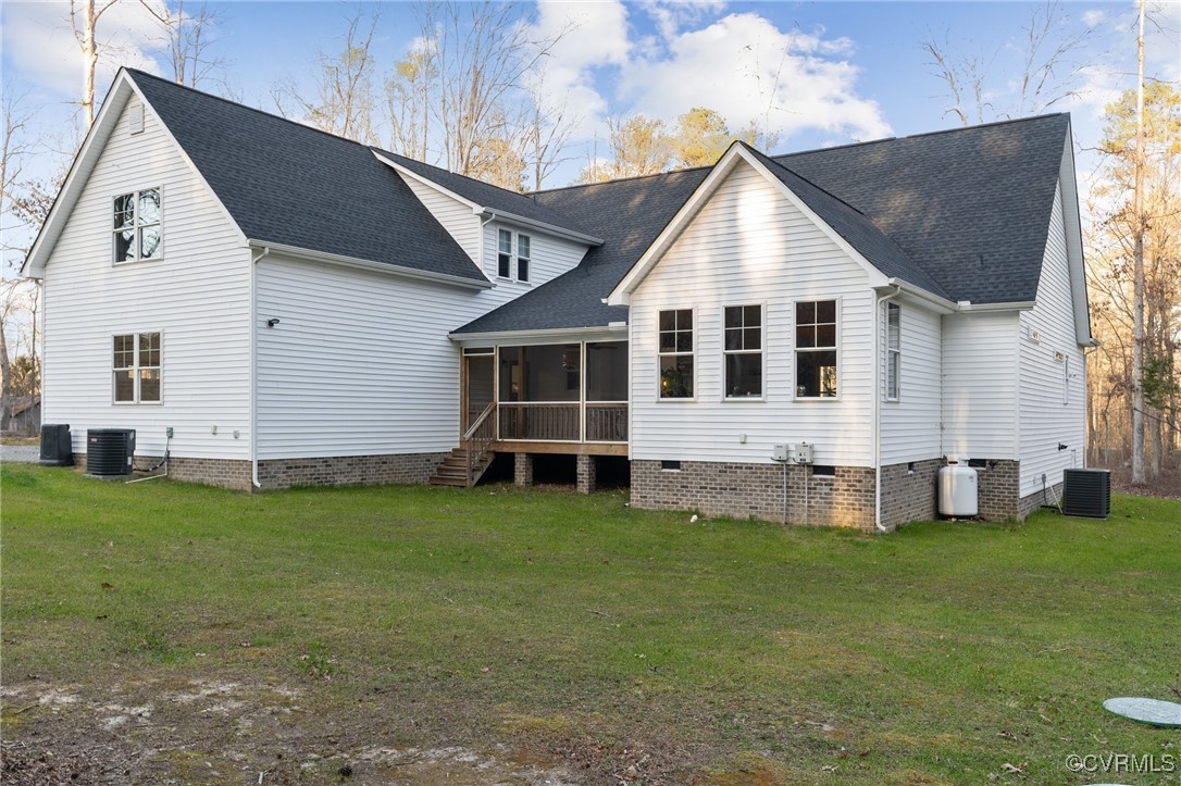 13279 Hanover Courthouse Road Hanover, VA 23069 - Photo 46 of 50 Rear view of property featuring central AC, a lawn