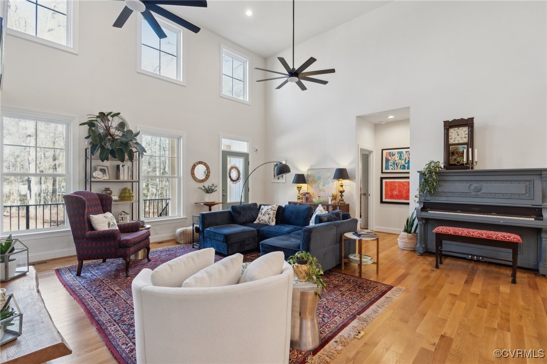 Living room with recessed lighting, light wood-typ