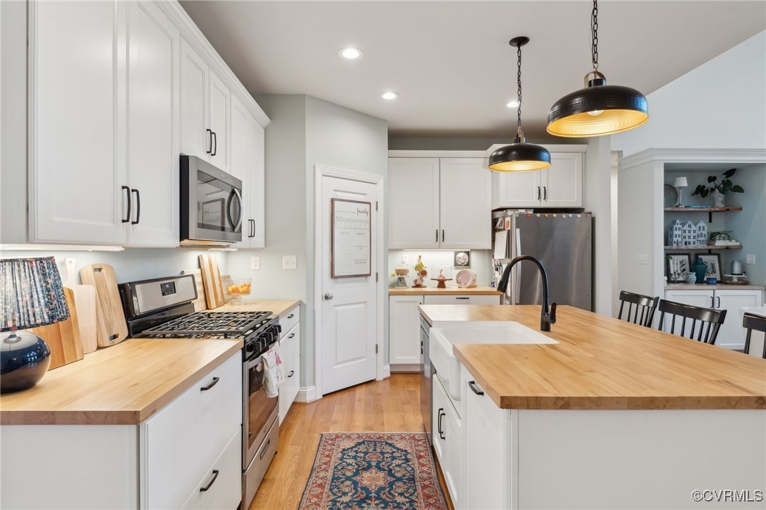 13279 Hanover Courthouse Road Hanover, VA 23069 - Photo 10 of 50 Kitchen with wooden counters, an island with sink,