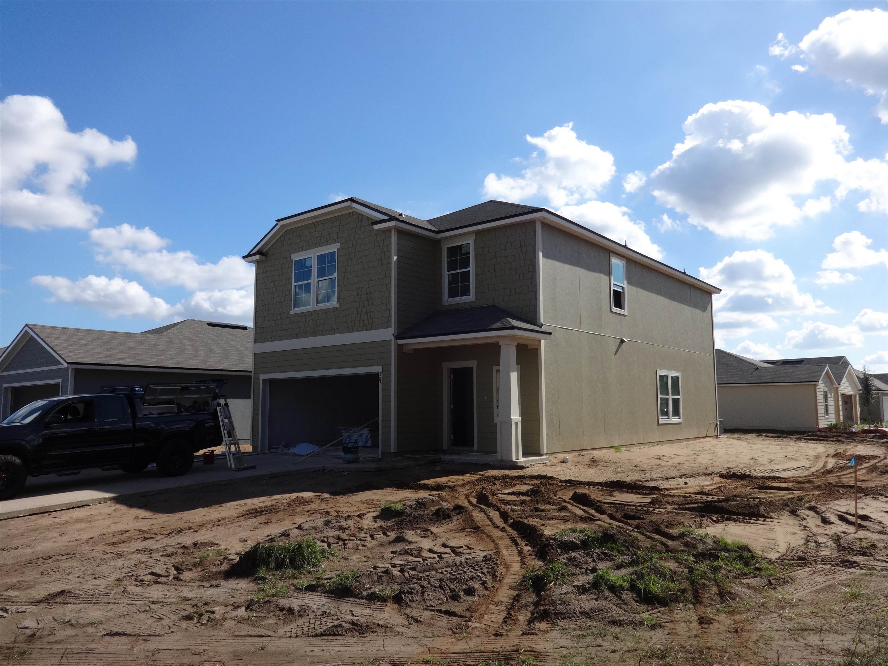 287 Falcon Ridge Road St. Augustine, FL 32084 - Photo 1 of 15 a front view of a house with a yard