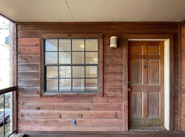 a front view of a house with a glass door