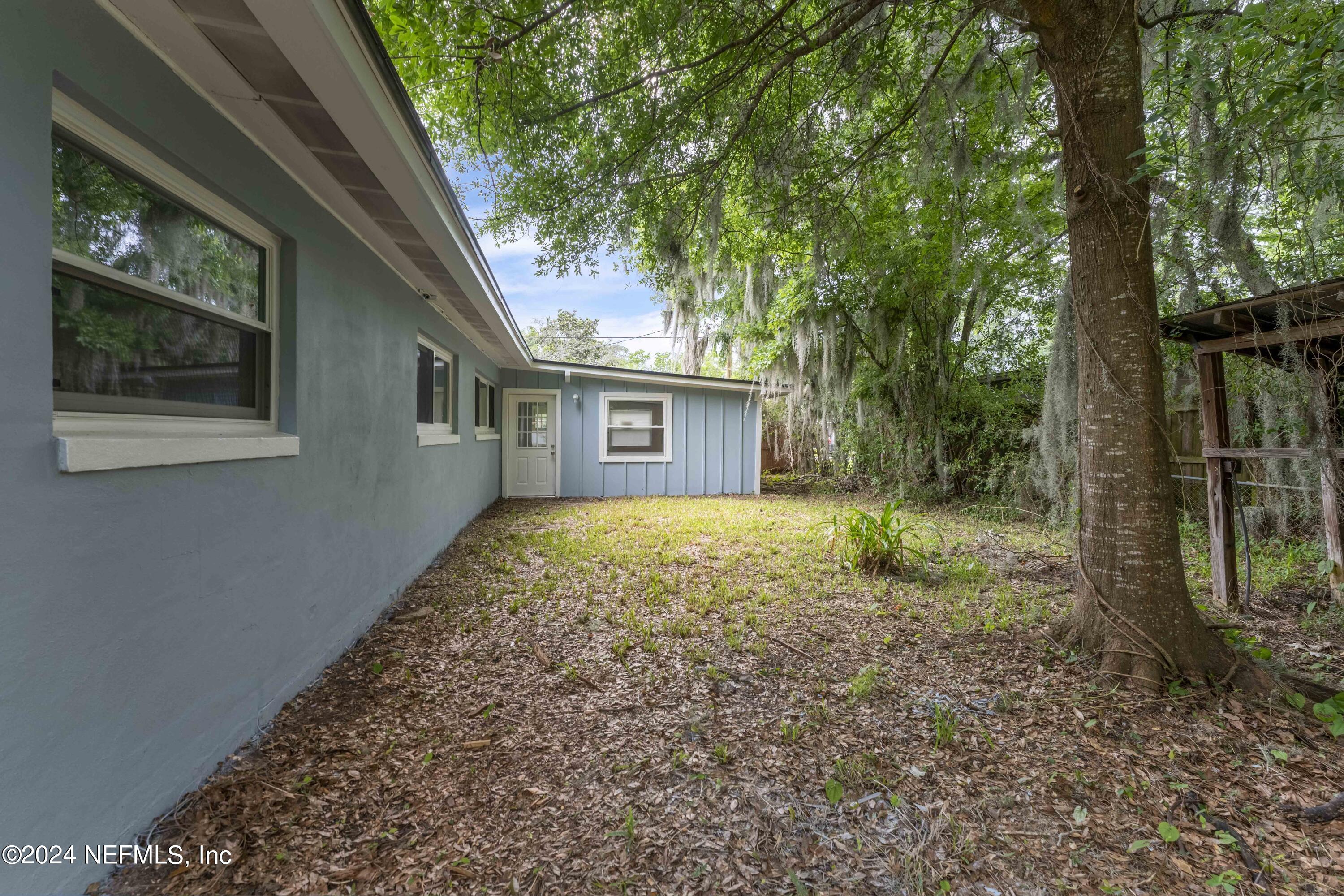 6937 Rollo Road Jacksonville, FL 32205 - Photo 25 of 26 a house with trees in front of it