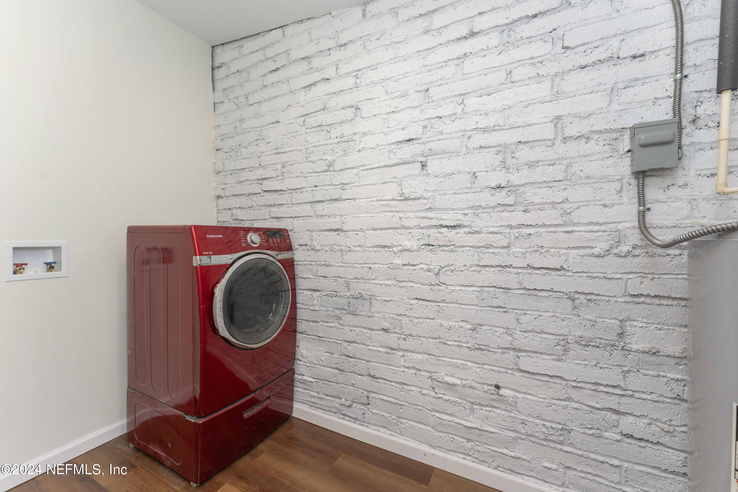 6937 Rollo Road Jacksonville, FL 32205 - Photo 9 of 26 a utility room with dryer and washer