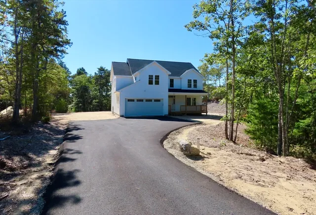 a view of a house with a snow in the yard