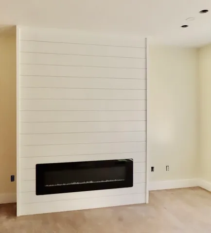 a kitchen with kitchen island white cabinets and white appliances