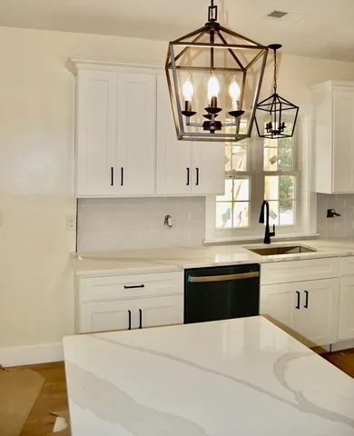 a bathroom with a sink a toilet and vanity