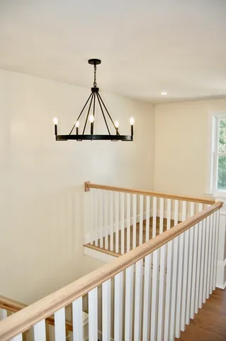 a bathroom with a double vanity sink toilet and tub