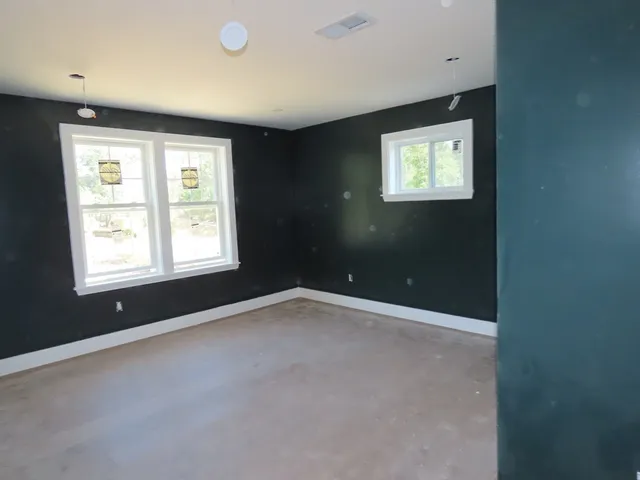 a bathroom with a bathtub and toilet