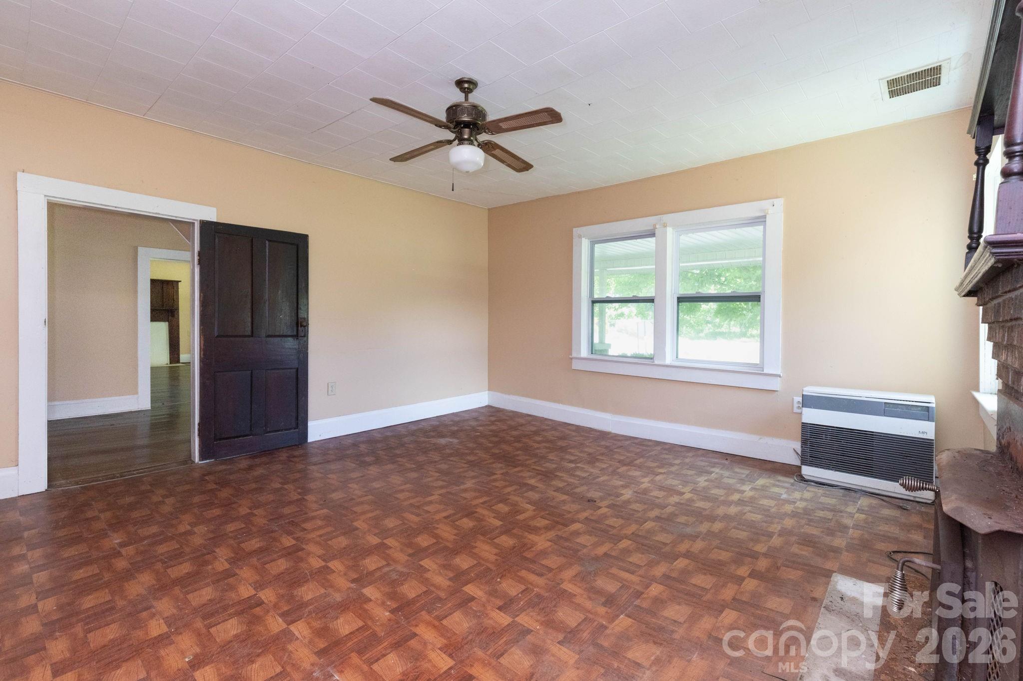 4085 Jacks Creek Road Burnsville, NC 28714 - Photo 11 of 24 a view of an empty room with a window