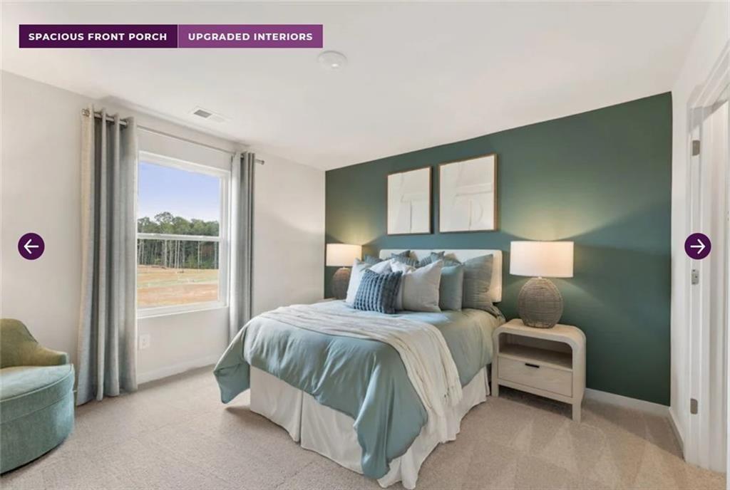 134 Poplar Blf Way Jefferson, GA 30549 - Photo 24 of 31 a bedroom with a bed and a large window
