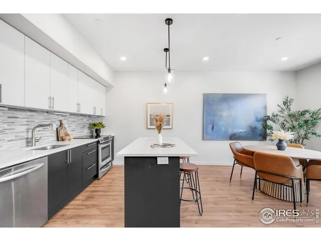 a kitchen with a table and chairs in it