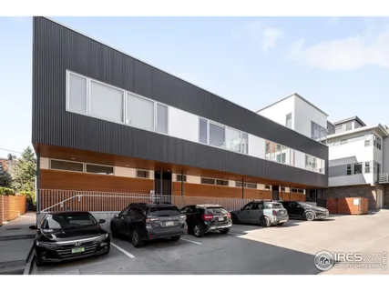 a view of a car parked in front of a building