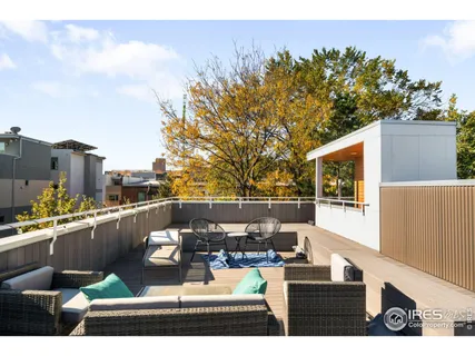 a view of a balcony with chairs
