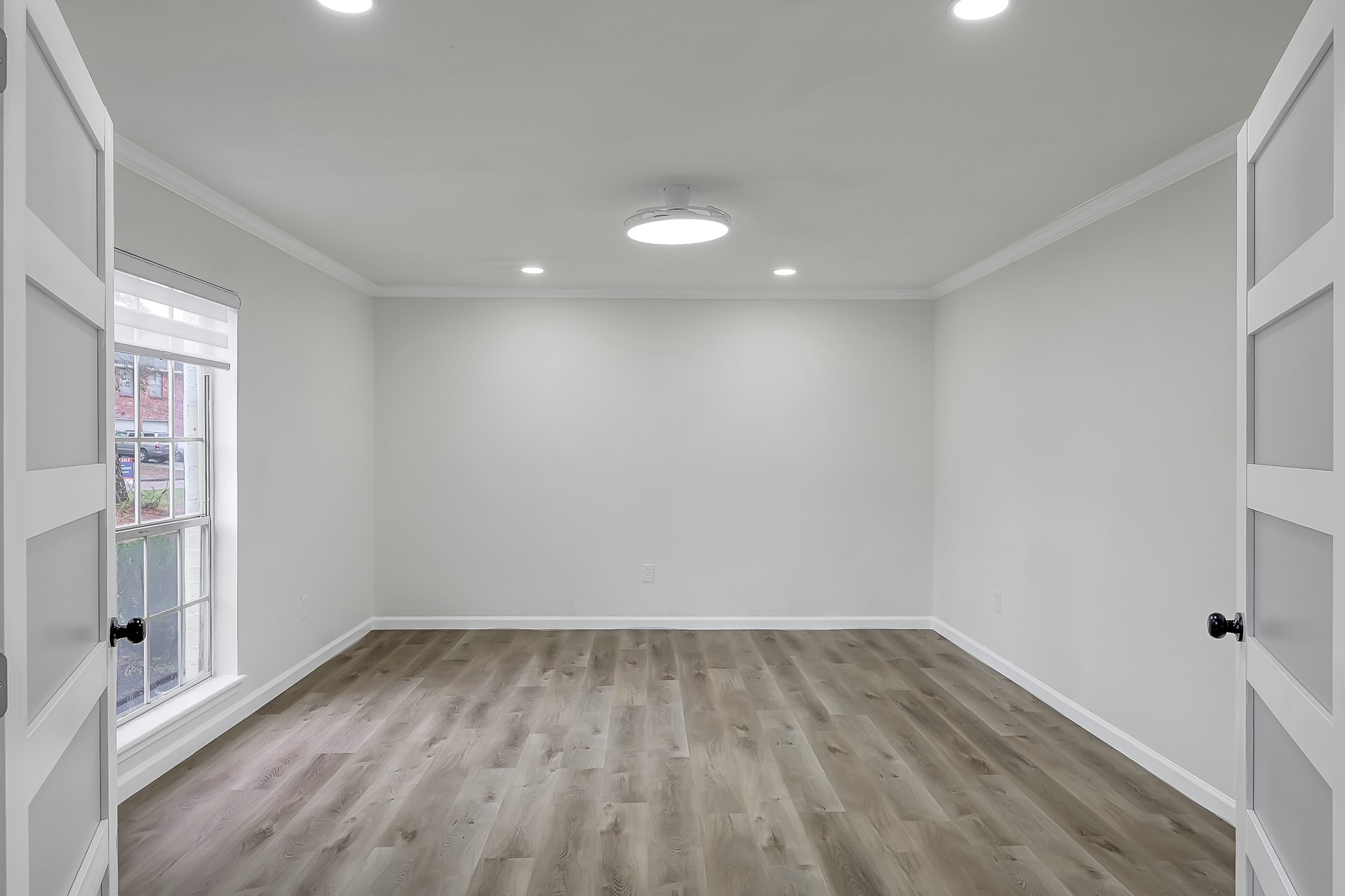 7610 Theisswood Road Spring, TX 77379 - Photo 15 of 42 wooden floor in an empty room with a window
