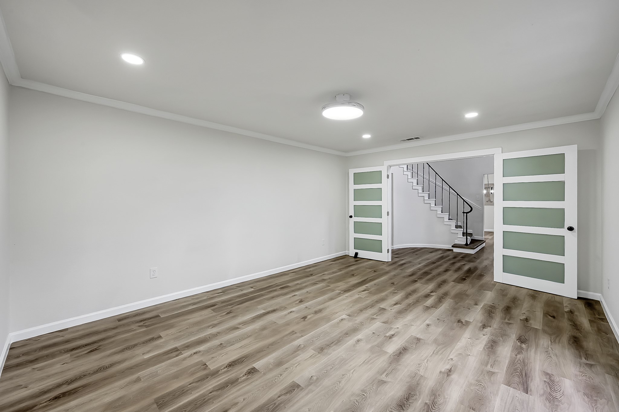 7610 Theisswood Road Spring, TX 77379 - Photo 17 of 42 a view of empty room with wooden floor and closet