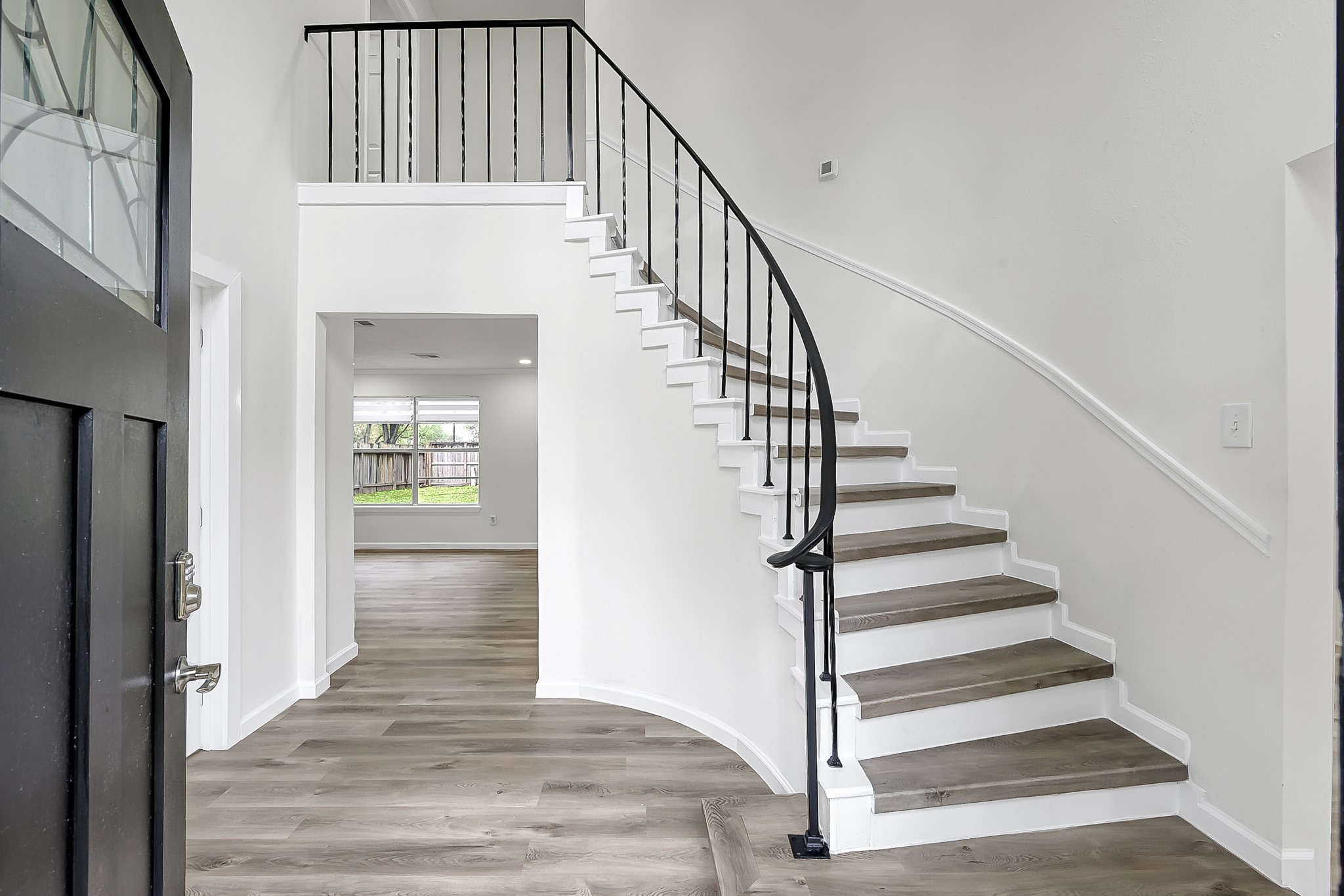 7610 Theisswood Road Spring, TX 77379 - Photo 19 of 42 a view of entryway and hall with wooden floor