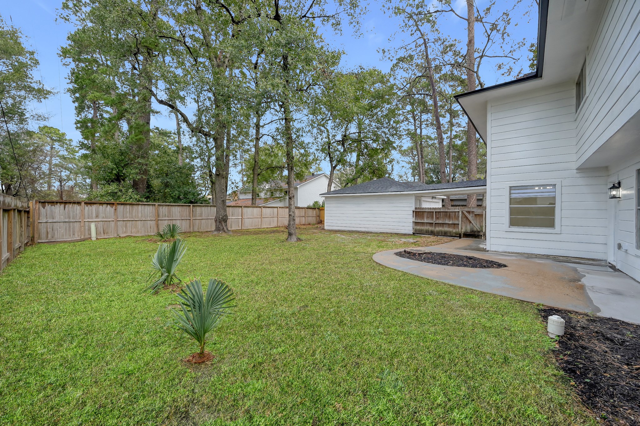 7610 Theisswood Road Spring, TX 77379 - Photo 34 of 42 a view of a backyard with a slide