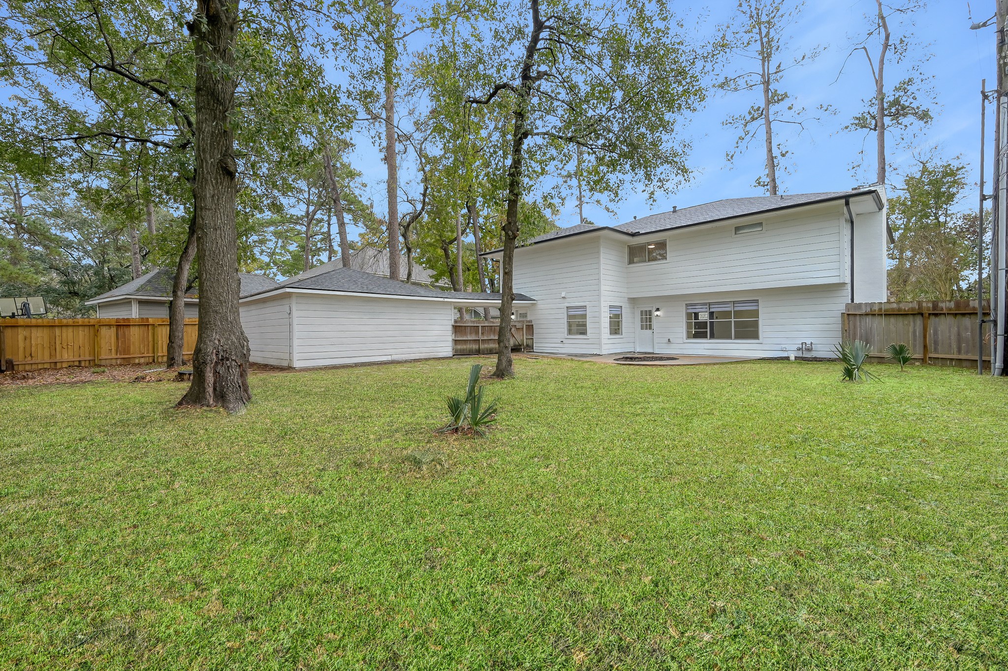 7610 Theisswood Road Spring, TX 77379 - Photo 35 of 42 a house view with a sitting space and garden