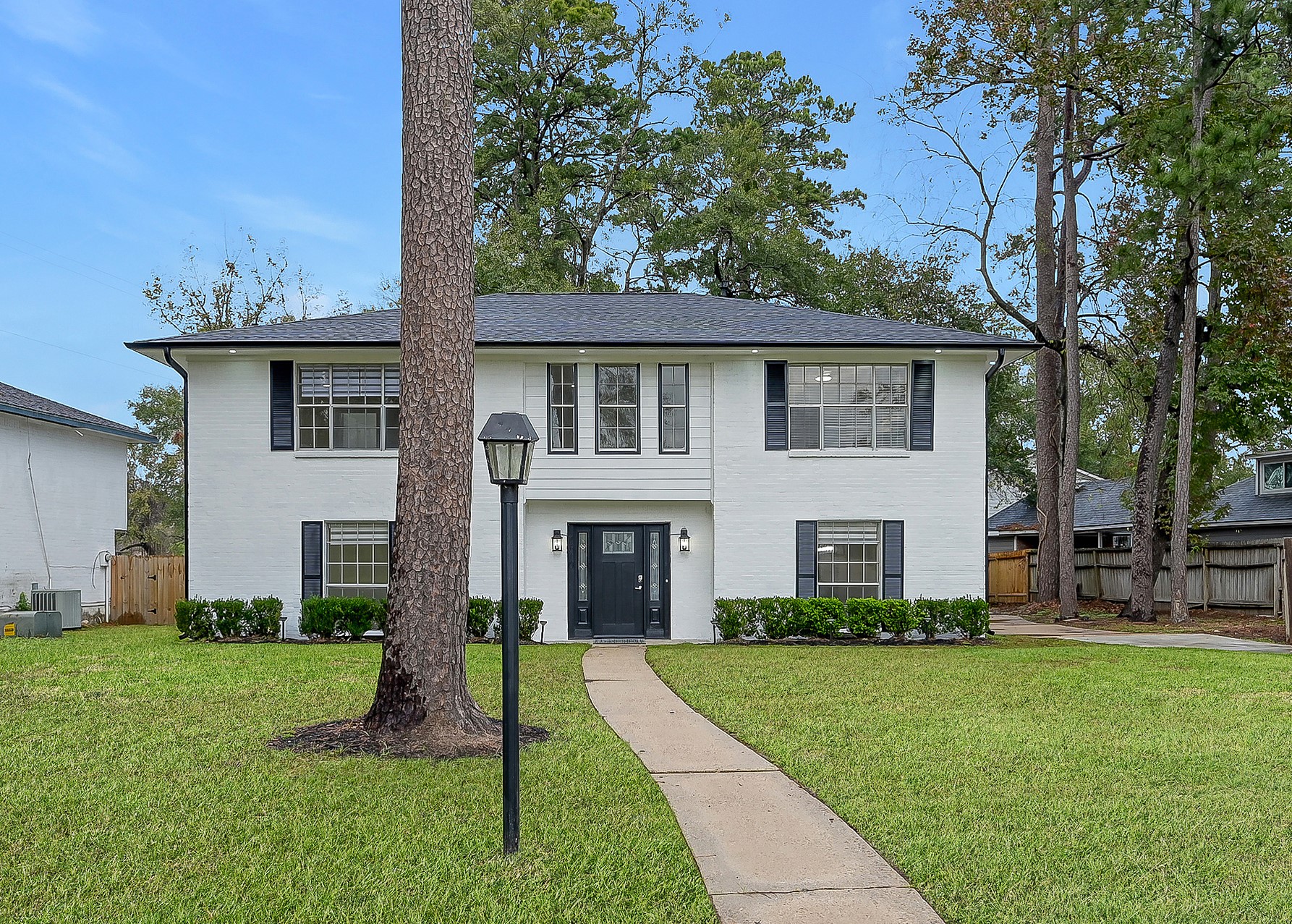 7610 Theisswood Road Spring, TX 77379 - Photo 36 of 42 front view of a house with a yard
