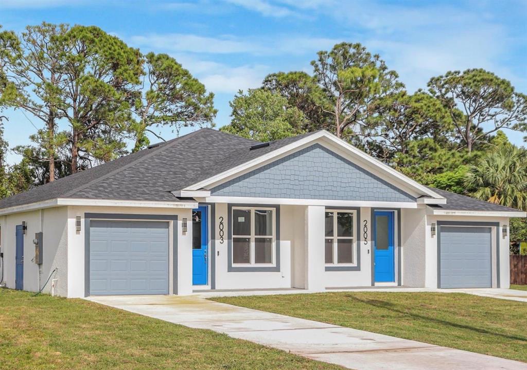 2005 Guava Drive Edgewater, FL 32141 - Photo 1 of 14 a front view of a house with a garden