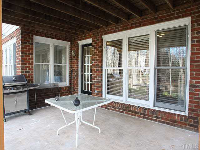 7017 Spring Ridge Road Cary, NC 27518 - Photo 24 of 25 Patio at the basement level offers another outdoor living area. Patio/Deck