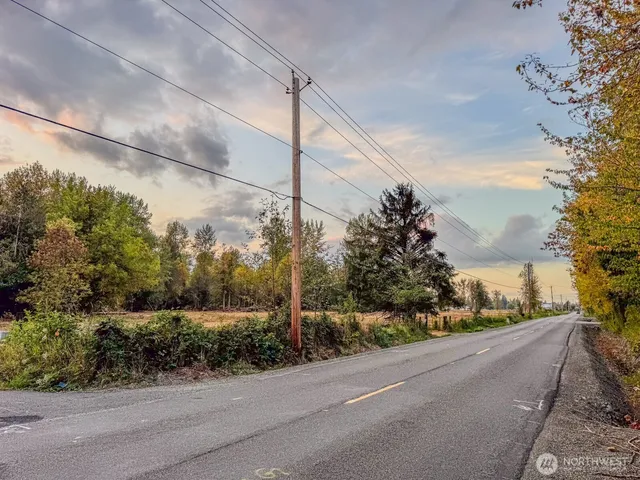 a view of a city street with a building in the background