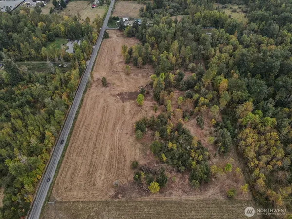 an aerial view of house with yard