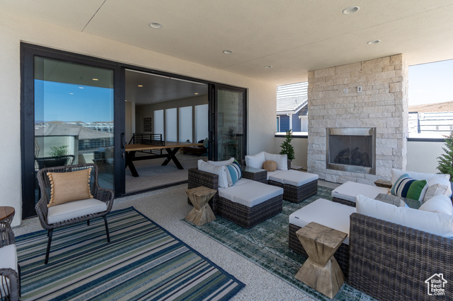 5355 Cyan Lane St. George, UT 84790 - Photo 2 of 6 View of patio with an outdoor living space with a fireplace
