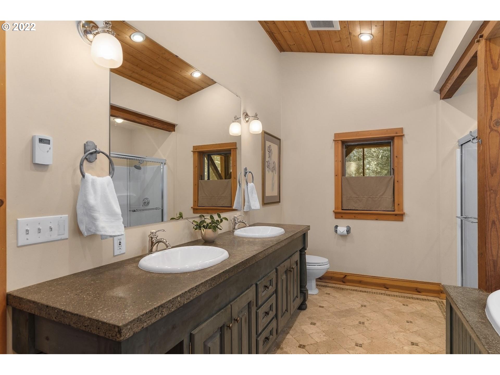 181 Lyons Road White Salmon, WA 98672 - Photo 13 of 32 a bathroom with a sink and a mirror