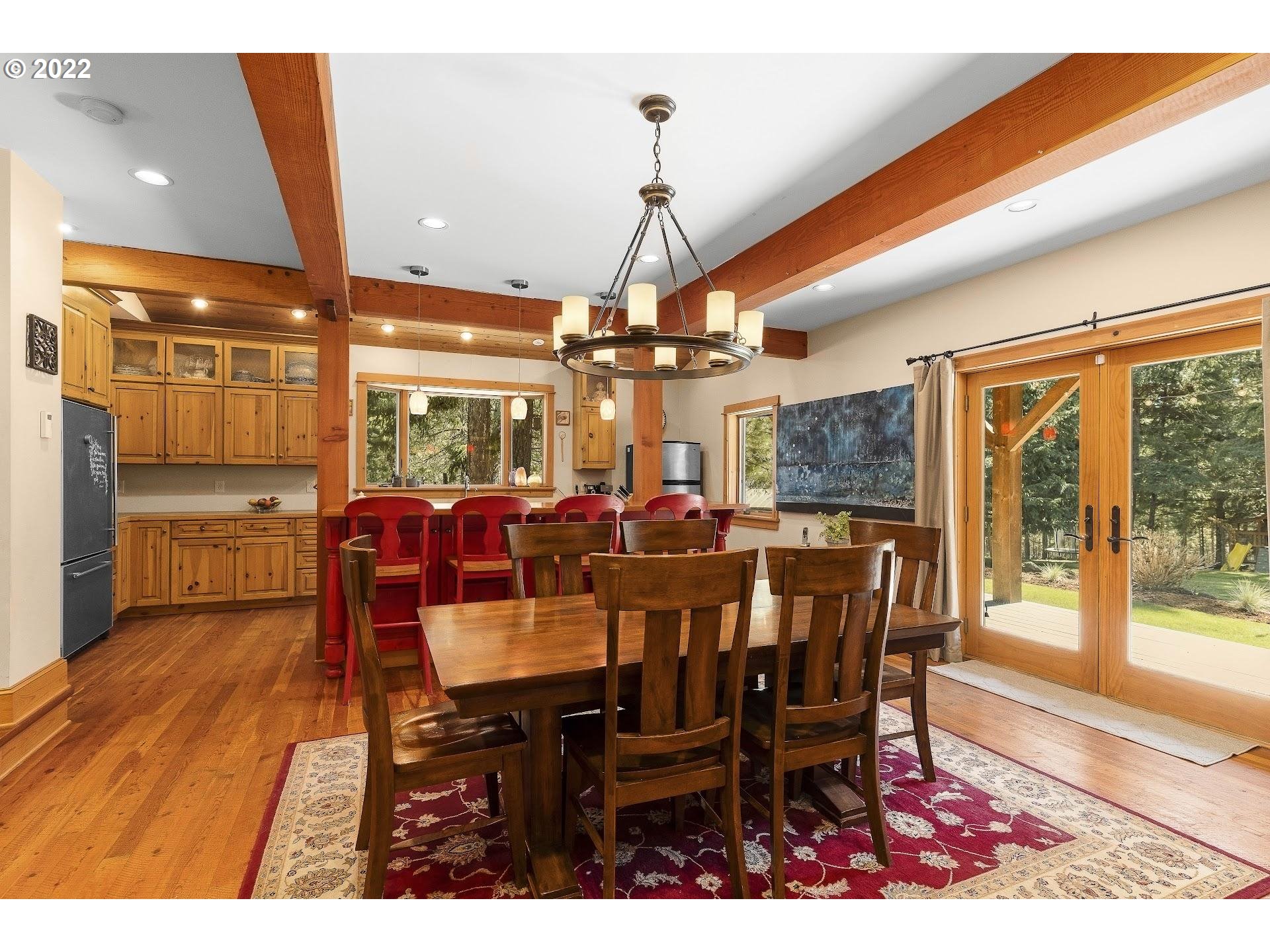 181 Lyons Road White Salmon, WA 98672 - Photo 8 of 32 a view of a dining room with furniture window and wooden floor