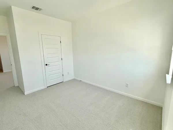 an empty room with cabinet