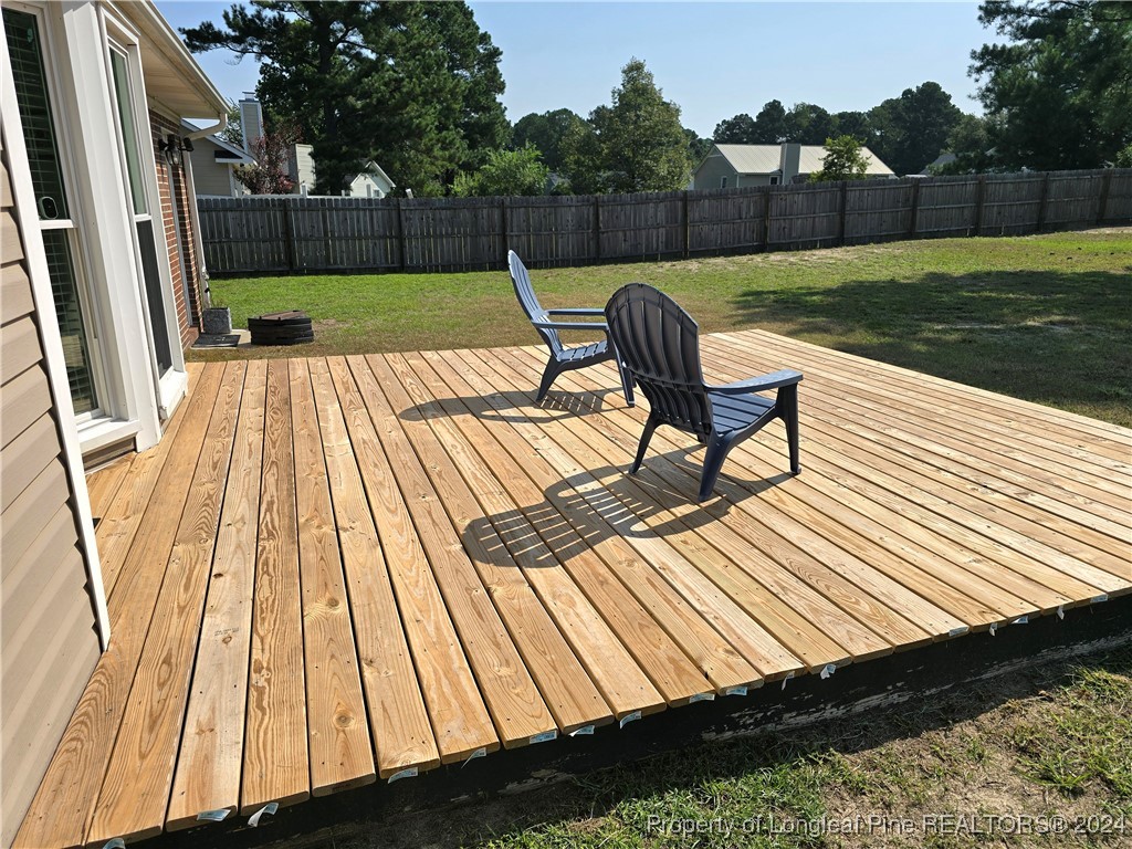 7605 Elliott Bridge Road Spring Lake, NC 28390 - Photo 29 of 36 a view of backyard with seating and green space