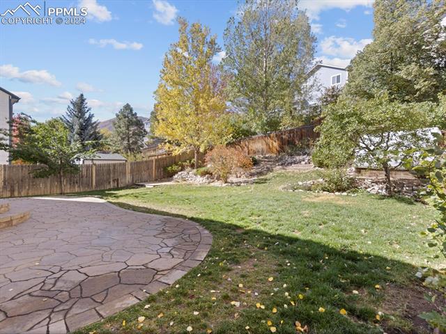 7590 Julynn Road Colorado Springs, CO 80919 - Photo 10 of 44 View of yard featuring a patio