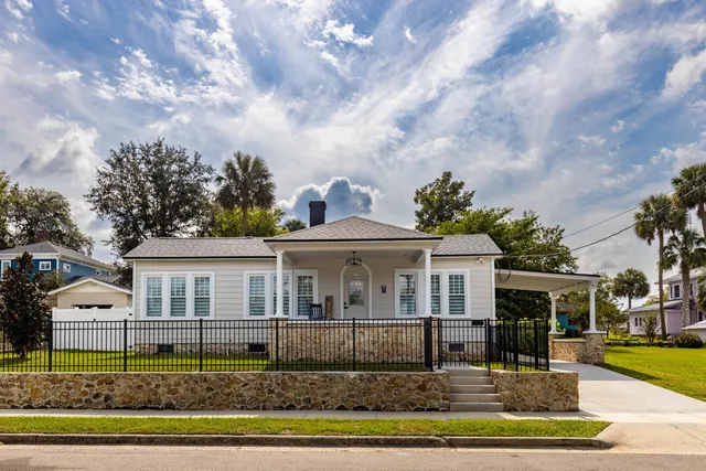 a front view of a house with garden