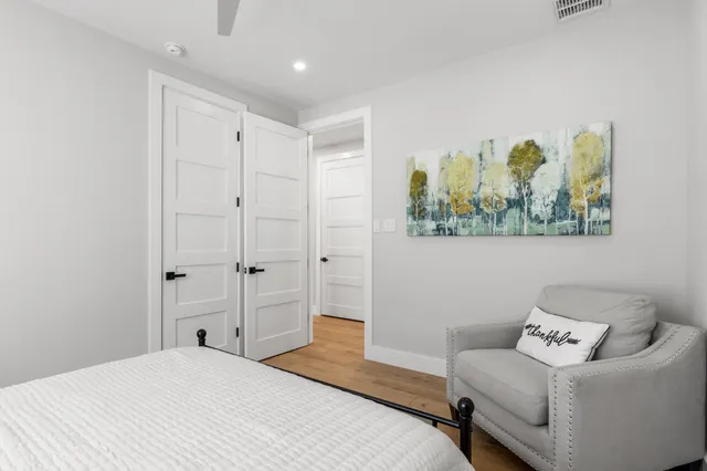 a bedroom with a bed and a couch