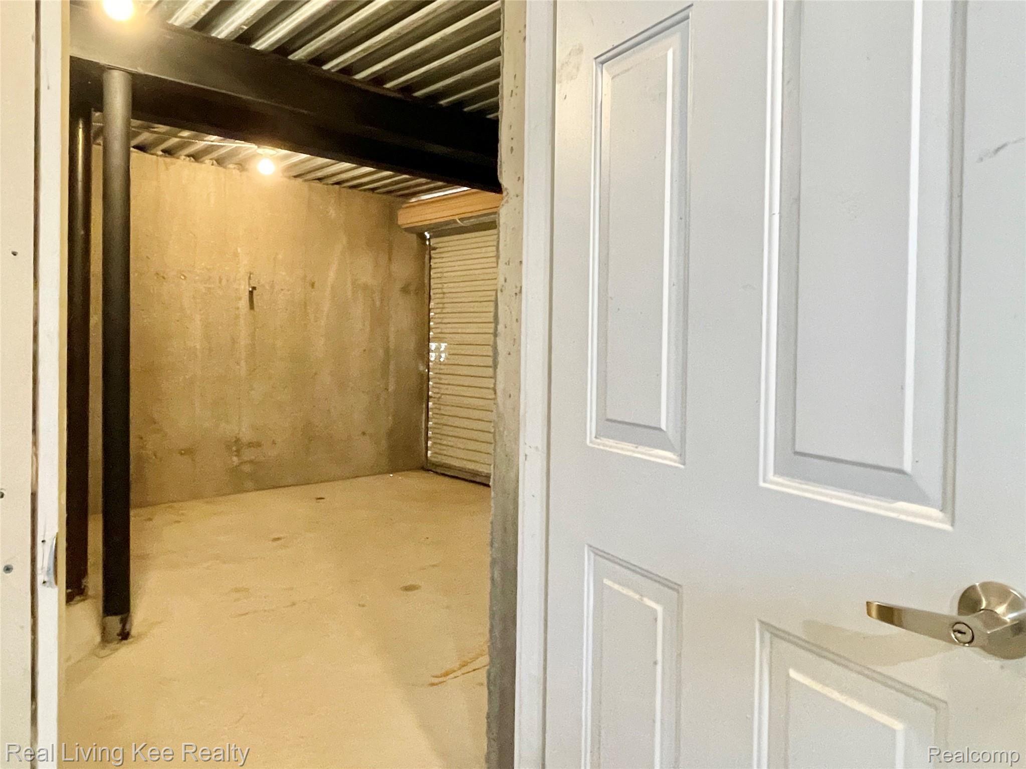 557 Curzon Road Rochester, MI 48307 - Photo 52 of 66 Door in basement opens to hobby or storage room with outdoor access
