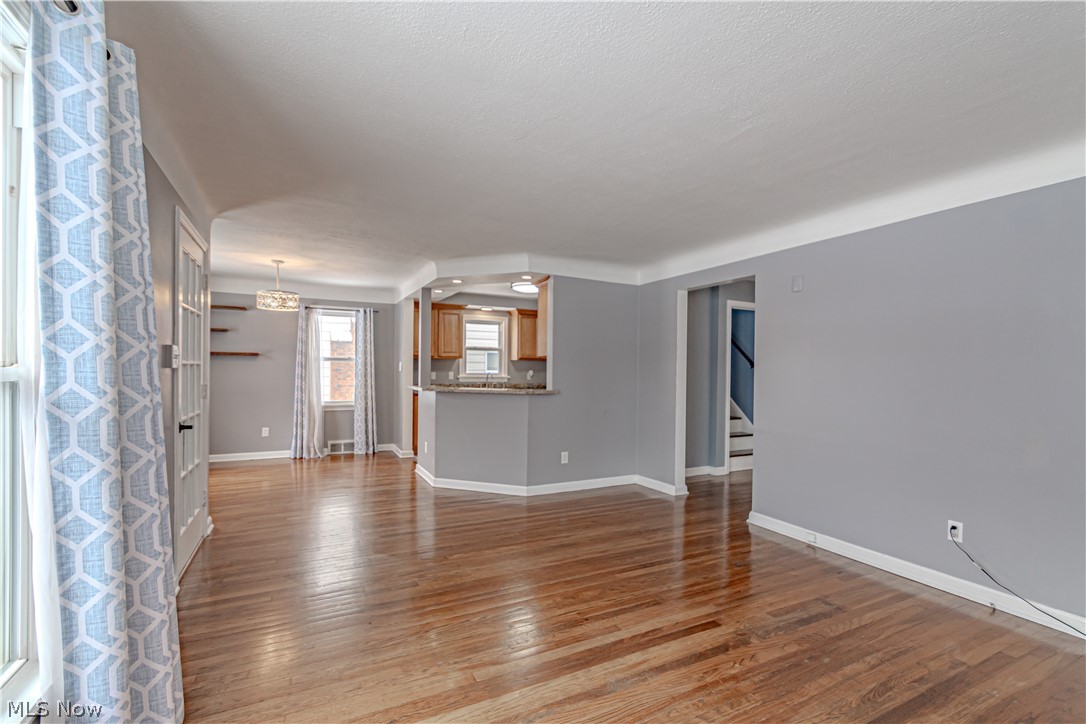 4157 Verona Road Cleveland, OH 44121 - Photo 9 of 26 Unfurnished living room with light wood-type flooring and baseboards