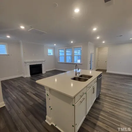 a kitchen with a stove and a sink