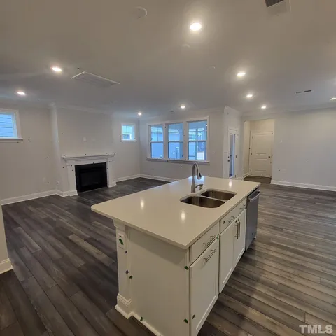 a kitchen with a stove and a sink