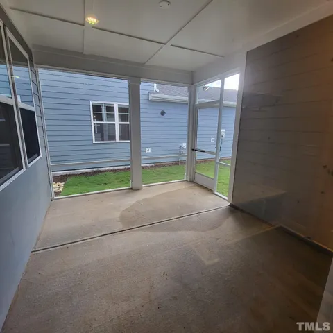 a view of empty room with yellow walls