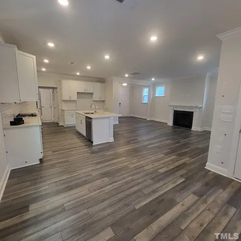a view of kitchen with cabinets stainless steel appliances