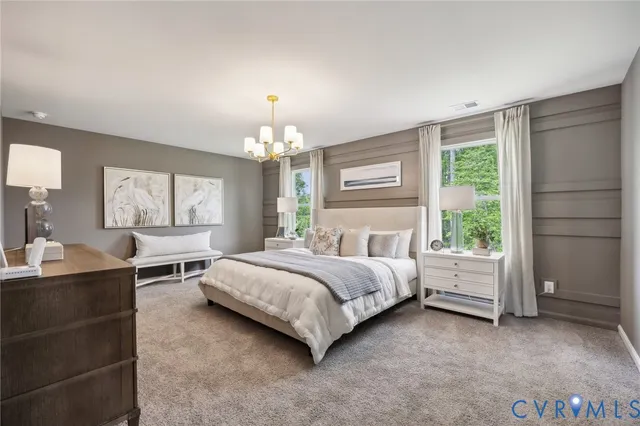 a spacious bedroom with a bed and window