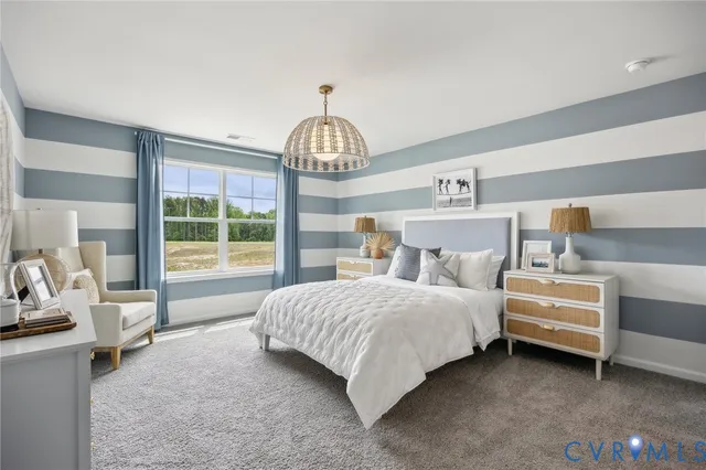 a bedroom with bed and a large window