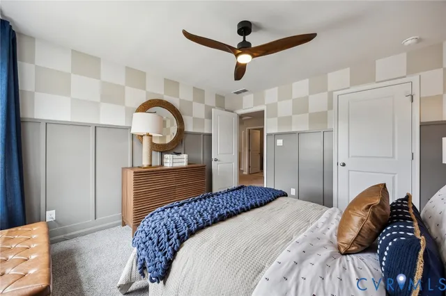 a bedroom with a bed and a dresser